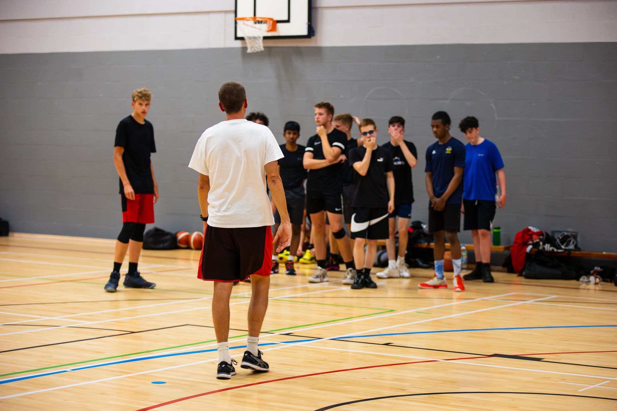 A Wirral Bears coach working with players during a session